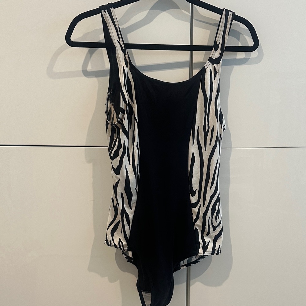 4/$14 SEXY BODYSUIT .SHEERNESS TO THE CENTER FABRIC.GREAT UNDER A BLAZER.